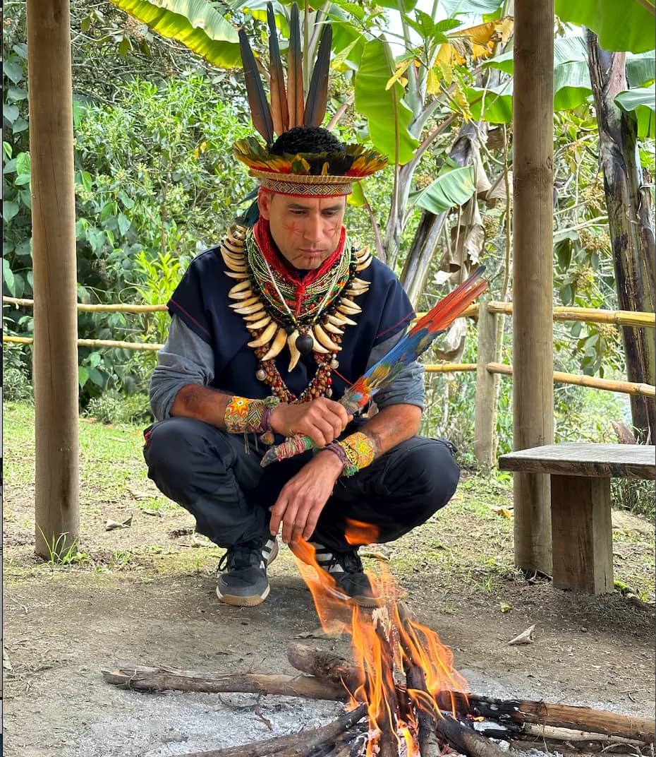 Taita Diego Marmolejo praying by the sacred fire at Camino al Sol