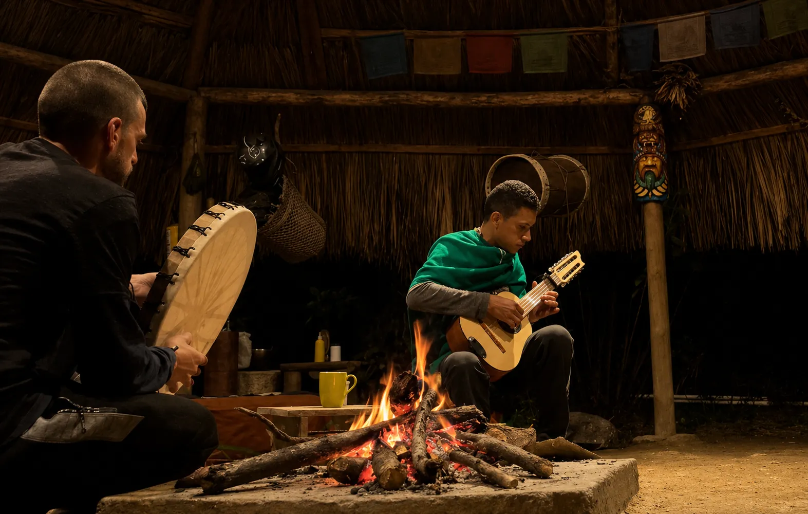 Musicians gathered around a fire inside the bohio