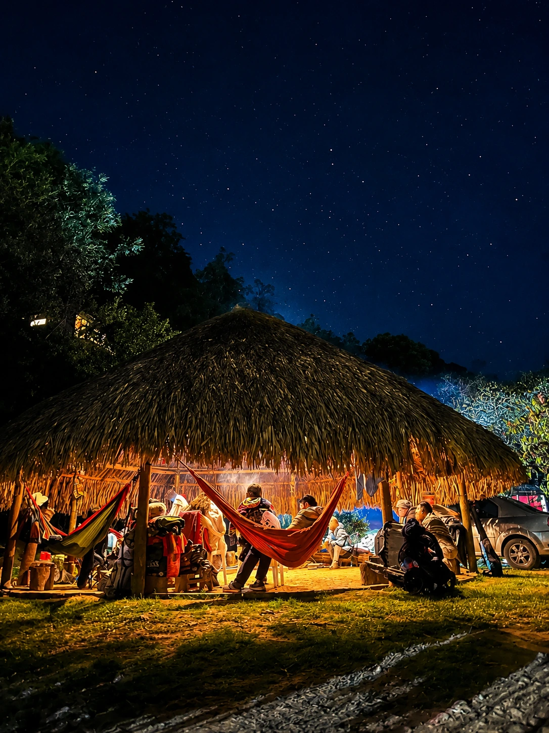 The bohio at night under a clear starry sky