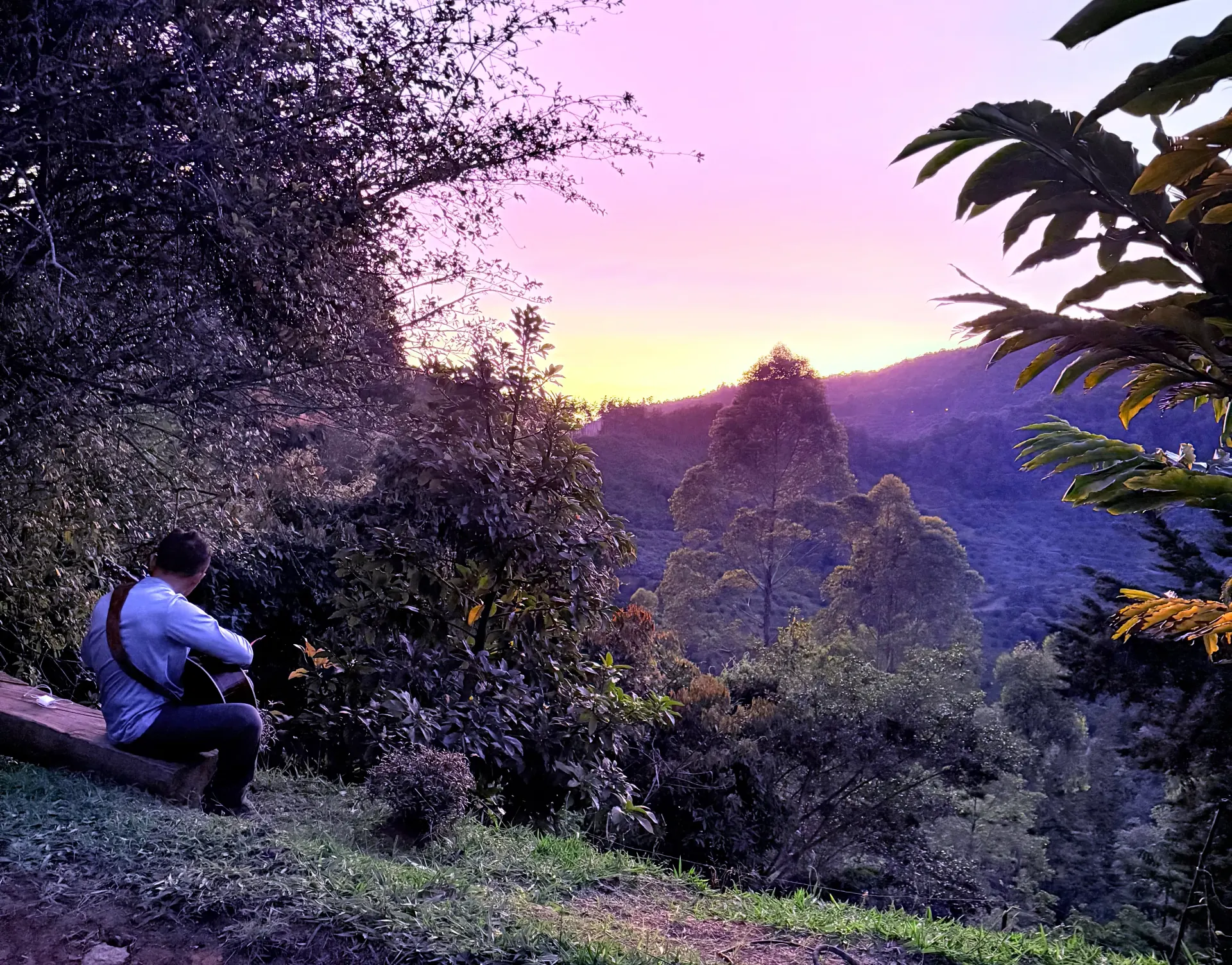 A person reflecting outdoors during sunset at Camino al Sol